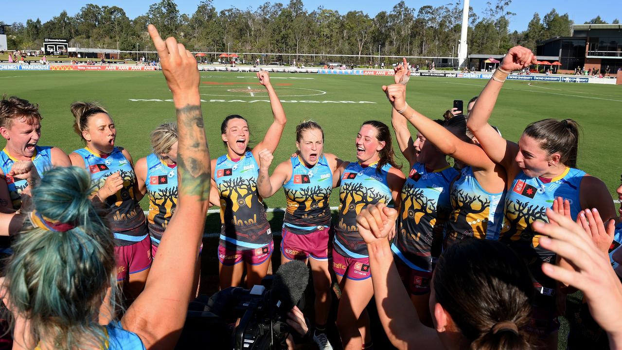 Lions players celebrate victory. Picture: Bradley Kanaris