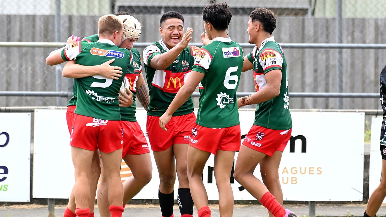 Wynnum Manly players celebrate. In the middle is Dean Tauaa. Picture, John Gass