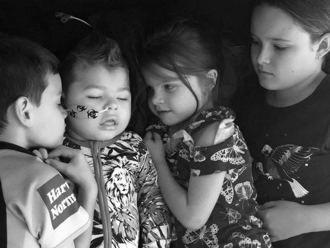 Addison, 6, Mason, 2, Ava, 5 and Paige, 9, say goodbye to their baby brother, Mason. Picture: Mason's Journey/Facebook