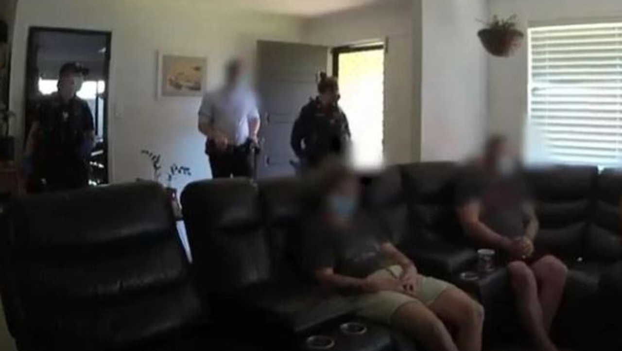 Police raid the Yeppoon house last year.