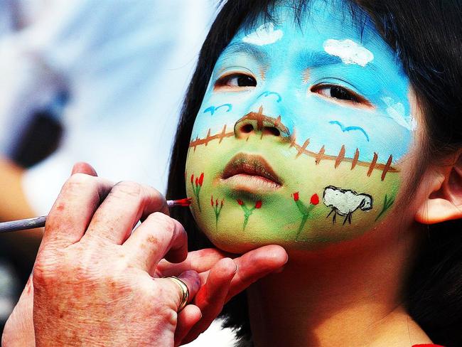 Holly Trieu, 5, gets her face painted at the moon festival in 2003. Picture: Daniel Griffiths.