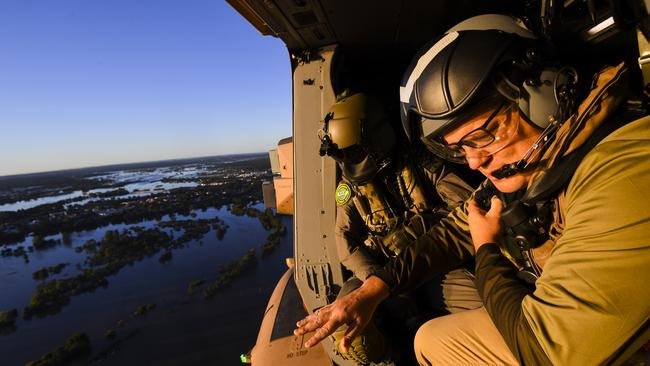 Prime Minister Scott Morrison inspects damage created by floodwaters from a helicopter during a visit to flood affected areas in Sydney today. Picture: AAP