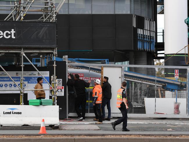 Police at the Adelaide Medical and Nursing projects on North Terrace where the incident happened. Picture: Naomi Jellicoe