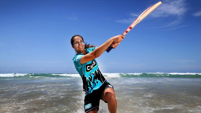 Josie Dooley, pictured at Surfers Paradise, is also a keen surfer. Picture: Adam Head