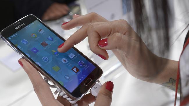 The new Samsung Galaxy S5 is displayed at the Mobile World Congress, the world's largest mobile phone trade show in Barcelona, Spain, Tuesday, Feb. 25, 2014. Expected highlights include major product launches from Samsung and other phone makers, along with a keynote address by Facebook founder and chief executive Mark Zuckerberg. (AP Photo/Manu Fernandez) Picture: Ap