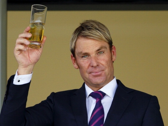 ASCOT, UNITED KINGDOM - JULY 27: (EMBARGOED FOR PUBLICATION IN UK NEWSPAPERS UNTIL 48 HOURS AFTER CREATE DATE AND TIME) Shane Warne raises his glass whilst watching the racing as he and Elizabeth Hurley attend the Betfair Weekend, featuring the King George VI and Queen Elizabeth Stakes, at Ascot Racecourse on July 27, 2013 in Ascot, England. (Photo by Max Mumby/Indigo/Getty Images)