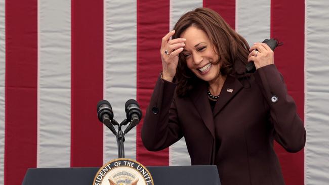 US Vice President Kamala Harris removes her mask while preparing to speak during a meeting of the National Space Council meeting in Washington.