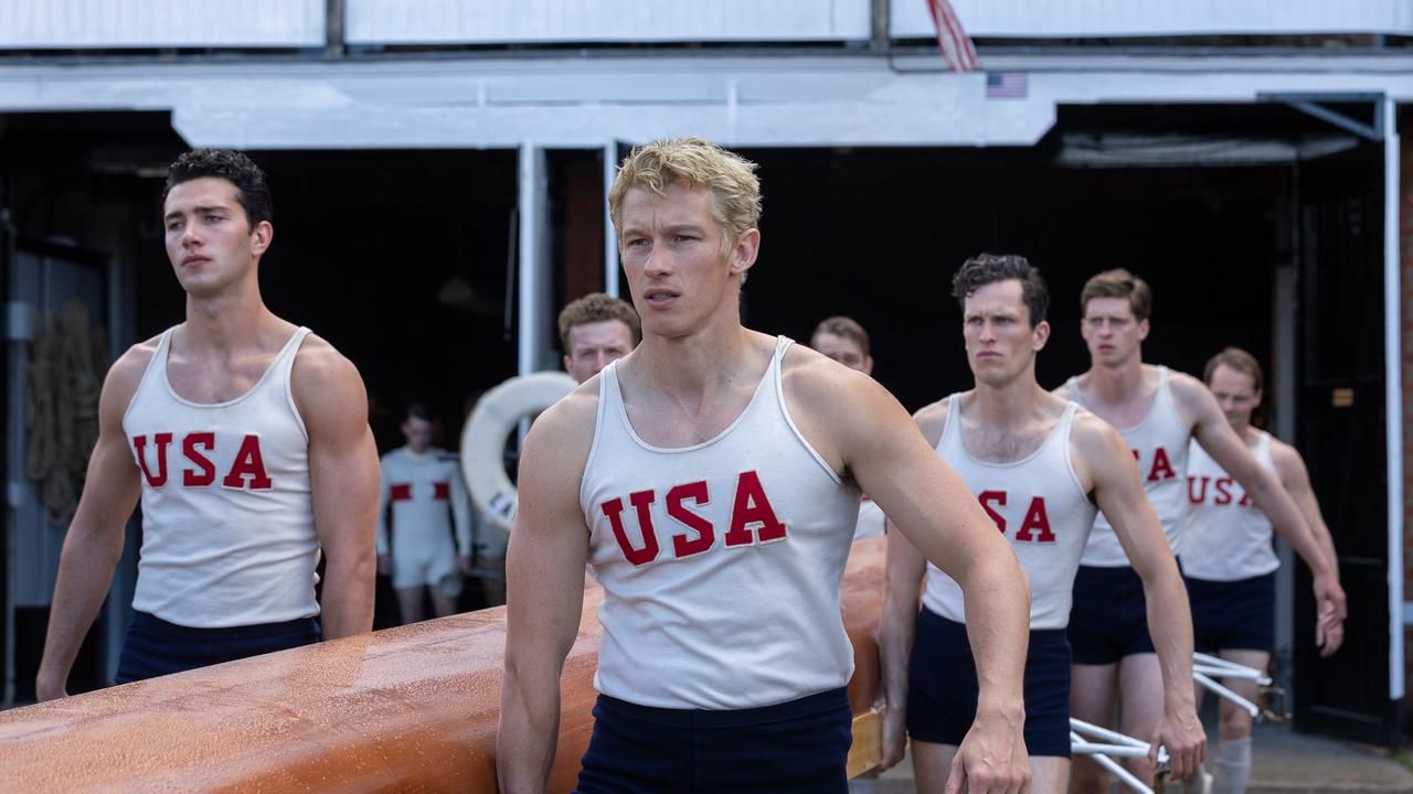 Bruce Herbelin-Earle stars as Shorty Hunt, Callum Turner as Joe Rantz, and Wil Coban as Jim McMillan in director George Clooney’s The Boys in the Boat.