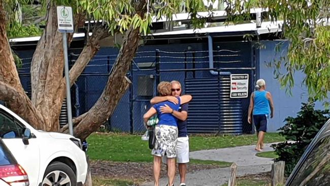 Mourners comfort each other after it was announced police had found the body of missing man Luke Howard. Picture: Matty Holdsworth