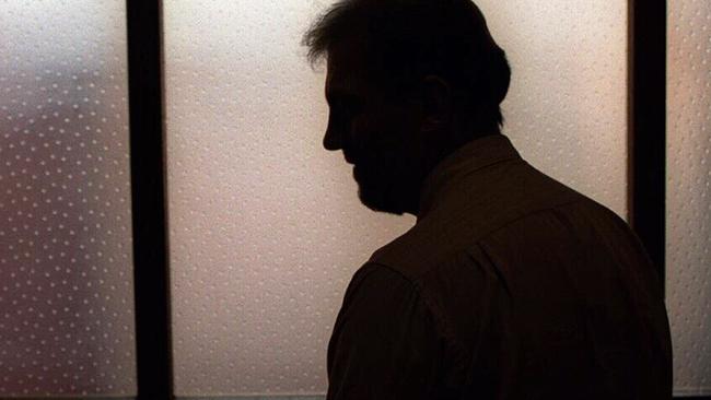 Generic image. Silhouette of a man (parent of) a sex abuse victim in an office. wrongly accused of touching young girl. Child sexual abuse. sex crime incest paedophilia.