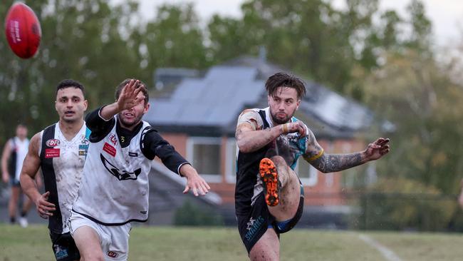 EDFL: Zak Wunhym kicks a goal for Hillside. Picture: George Sal