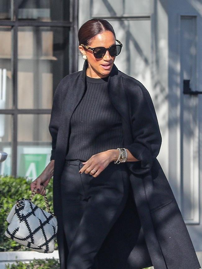 Meghan was all smiles as she left Gracias Madre in West Hollywood after an International Women's Day celebration on March 9. Picture: Backgrid