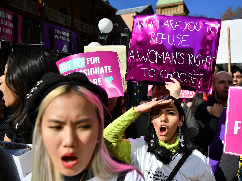 Pro-choice advocates during a rally outside the New South Wales Parliament house in Sydney, Tuesday, August 6, 2019. (AAP Image/Joel Carrett)