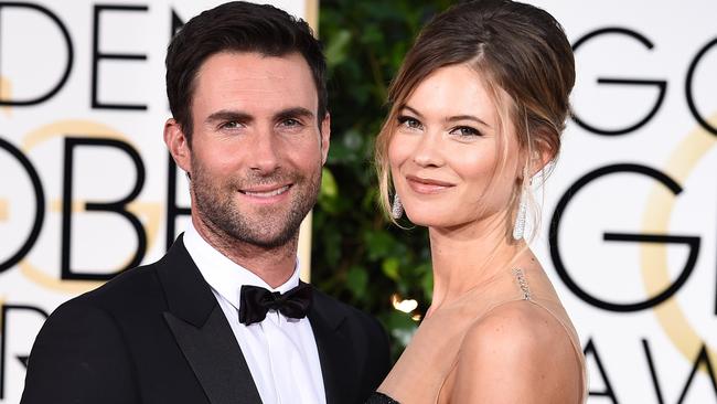 Adam Levine and Behati Prinsloo arrive at the 72nd annual Golden Globe Awards.