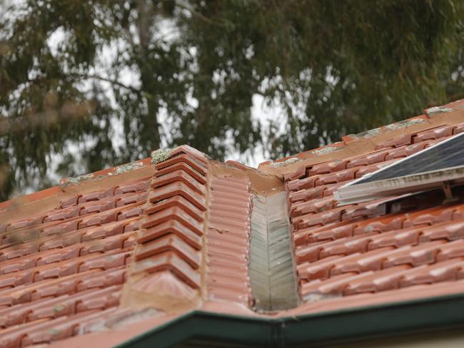 The roof tiles of a Mount Waverley resident’s home, Kaye Huxtable. Dodgy tradesmen started replacing them, but never came back to finish the job. Picture: Valeriu Campan