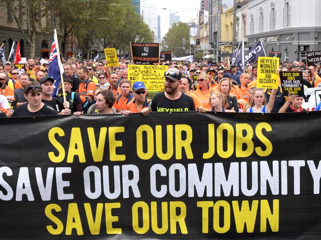 Workers protest the closure of the Heyfield Mill by marching and parking their trucks at Parliament House, Melbourne, Tuesday, March 21, 2017. (AAP Image/Tracey Nearmy) NO ARCHIVING