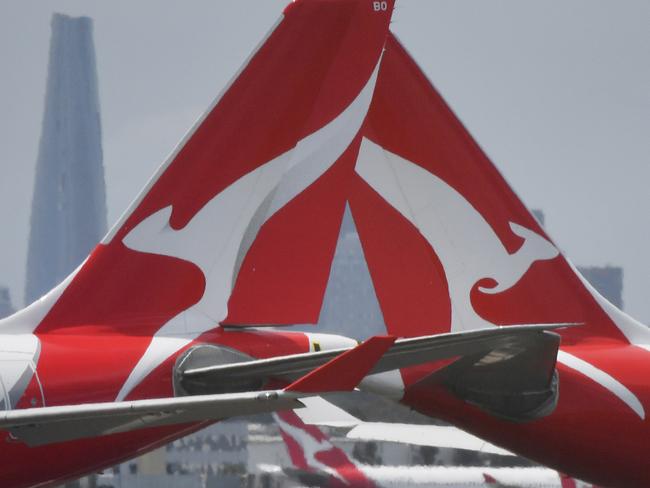 Qantas aircraft are seen at Sydney Airport, Thursday, 24 December 2020. Authorities are urgently investigating how a Qantas crew member contracted Covid-19 after arriving in Darwin from Paris and then flying to Sydney without being tested or quarantined. Federal health authorities are working with Qantas to understand how the man, who landed in Darwin on 17 December after working on a repatriation flight from Paris, became infected. Picture - Sam Mooy/The Australian Newspaper