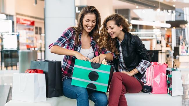 Happy girls in the shopping mall enjoying the purchases Christmas Townsville generic