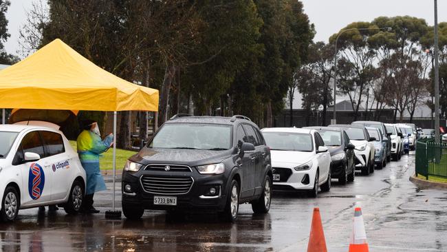 Workers at the pop up Gawler testing clinic at Trinity College. Picture: Jason Katsaras