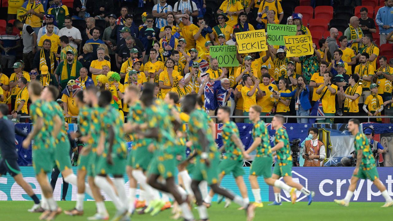 Australia supporters cheer on the Socceroos during their team warm-up. (Photo by JUAN MABROMATA / AFP)