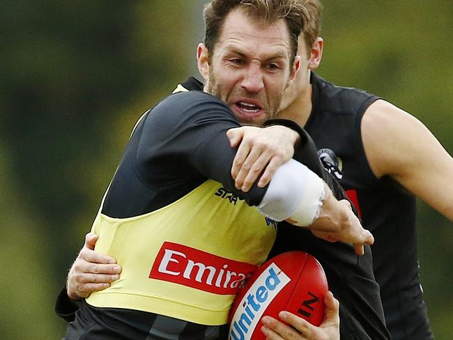 Collingwood training at Edwin Flack Oval, Travis Cloke gets tackled at training. Melbourne. 19th May 2016. Picture: Colleen Petch.