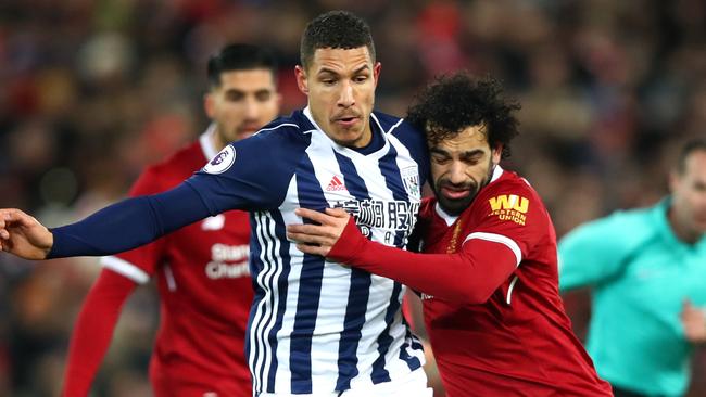 LIVERPOOL, ENGLAND - DECEMBER 13:  Jake Livermore of West Bromwich Albion is challenged by Mohamed Salah of Liverpool during the Premier League match between Liverpool and West Bromwich Albion at Anfield on December 13, 2017 in Liverpool, England.  (Photo by Clive Brunskill/Getty Images)