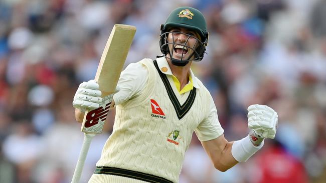 Pat Cummins celebrates after scoring the winning runs to defeat England. Picture: Getty Images.