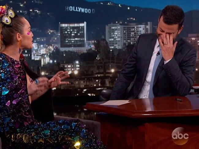 Kimmel can't look as Miley bares her heart-shaped pasties to cover her breasts. Picture: Jimmy Kimmel Live / ABC