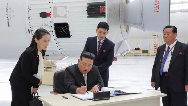 Kim Jong-un signs the visitor’s book at Russia’s Vostochny Cosmodrome on Wednesday. Picture: AFP