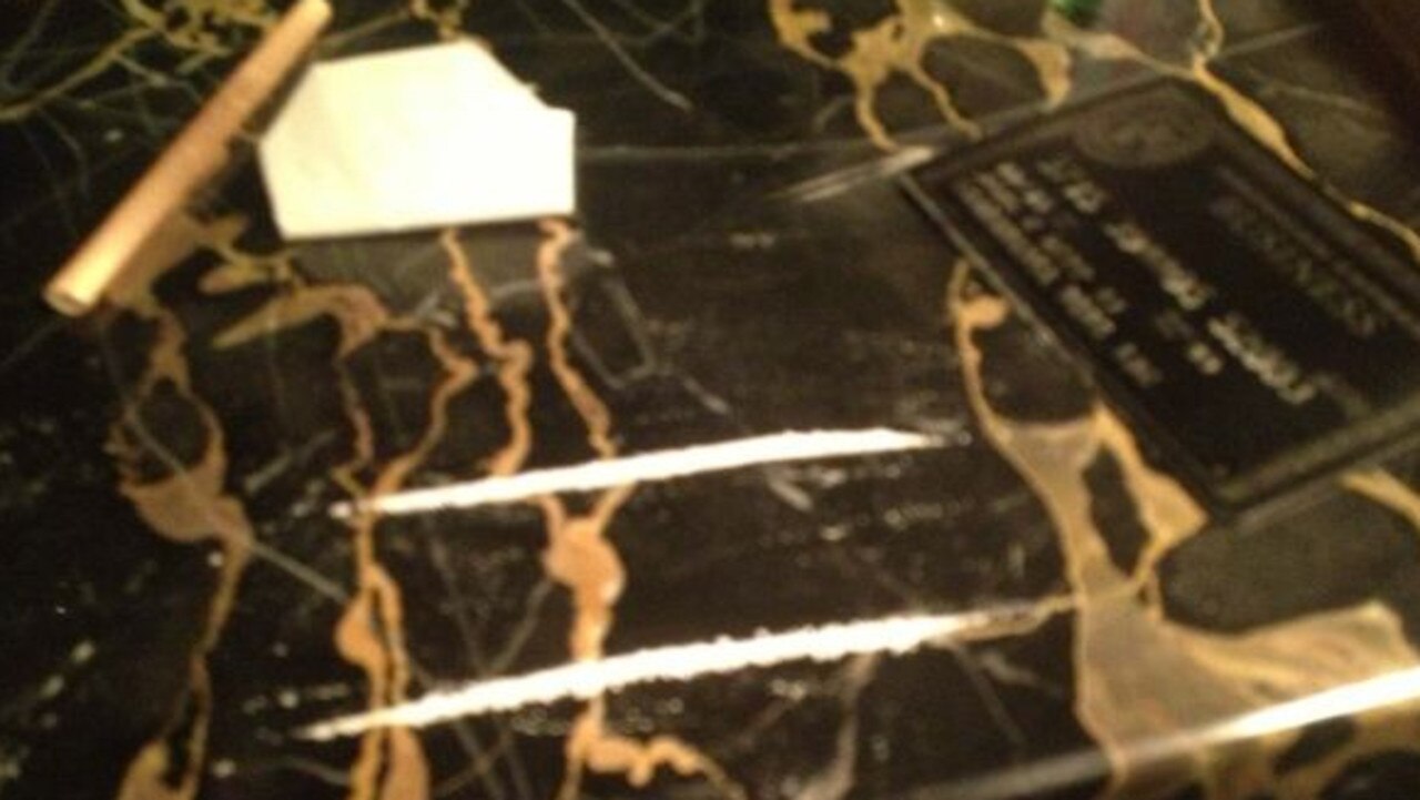 One of the images showed a table with white powder, a credit card, and a rolled-up note.