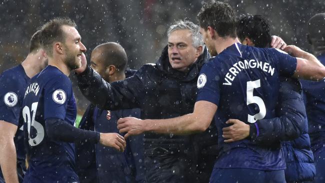 Tottenham manager Jose Mourinho, centre, celebrates with his players after their win against Wolverhampton Wanderers at Molineux. Picture: AP