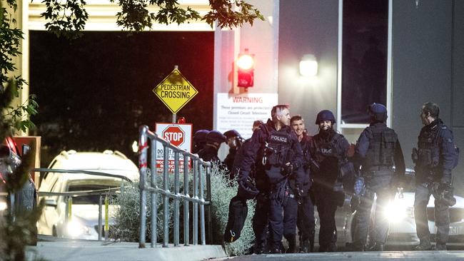 Police prepare to enter the centre the Melbourne Youth Justice Centre in Parkville. Picture: Mark Dadswell.