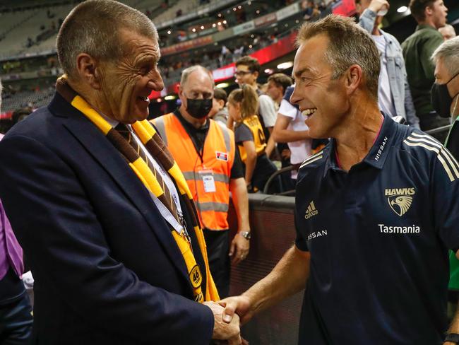 MELBOURNE, AUSTRALIA - MARCH 20: Jeff Kennett and Alastair Clarkson, Senior Coach of the Hawks (right) shake hands after the 2021 AFL Round 01 match between the Essendon Bombers and the Hawthorn Hawks at Marvel Stadium on March 20, 2021 in Melbourne, Australia. (Photo by Michael Willson/AFL Photos via Getty Images)