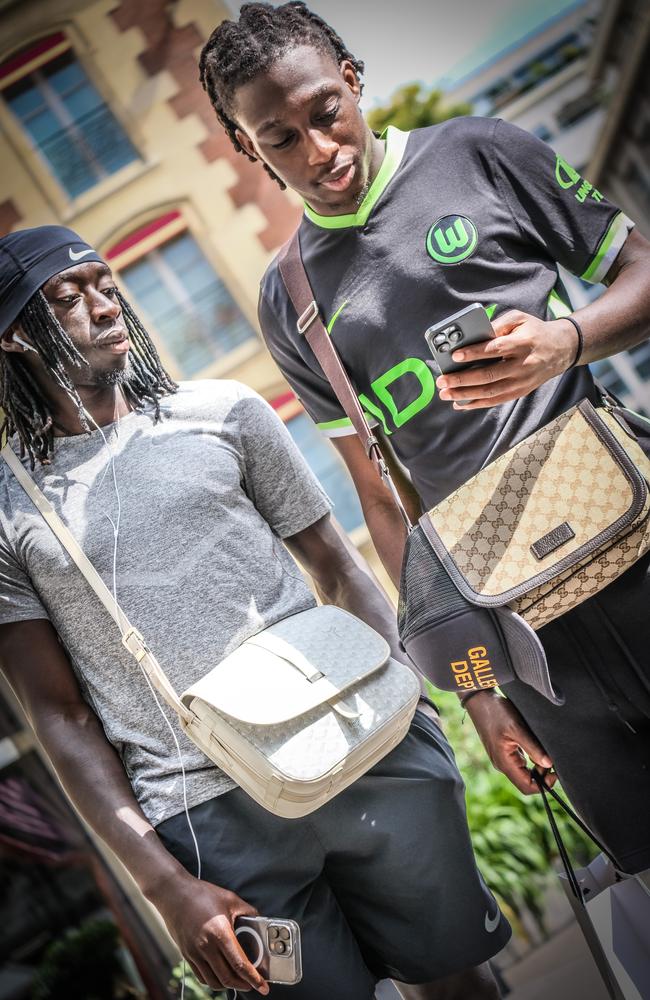 Professional soccer player Tanguy Coulibaly, 23, and his mate chill with their Goyard and Gucci. Picture: James Weir/news.com.au