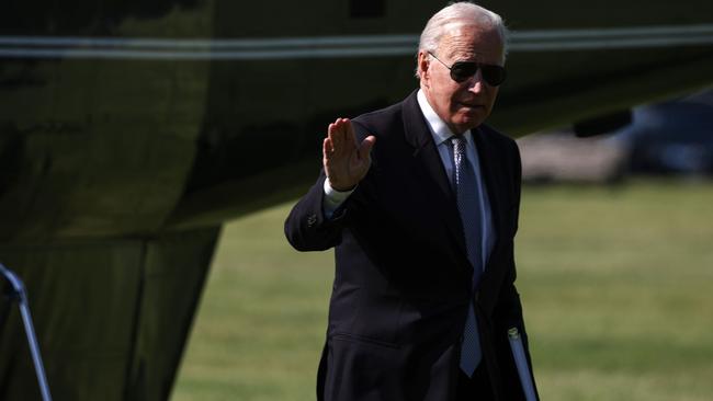 Joe Biden waves steps off Marine One in Washington. Picture: AFP.