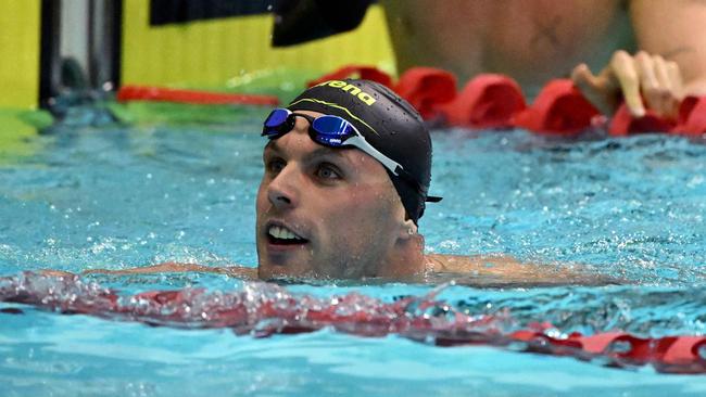 Cody Simpson (back) and Kyle Chalmers (front) of Australia look at their times after the men's 100m butterfly swimming final during the 2023 Australian World Championship Trials in Melbourne on June 18, 2023. (Photo by William WEST / AFP) / —IMAGE RESTRICTED TO EDITORIAL USE – STRICTLY NO COMMERCIAL USE —