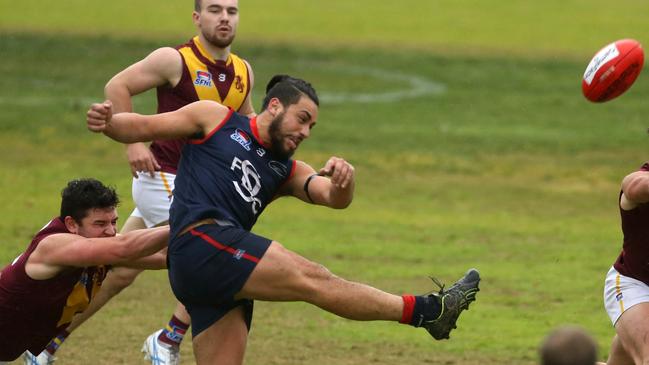 Sam Raru takes a kick for Springvale Districts. Picture: Stuart Milligan