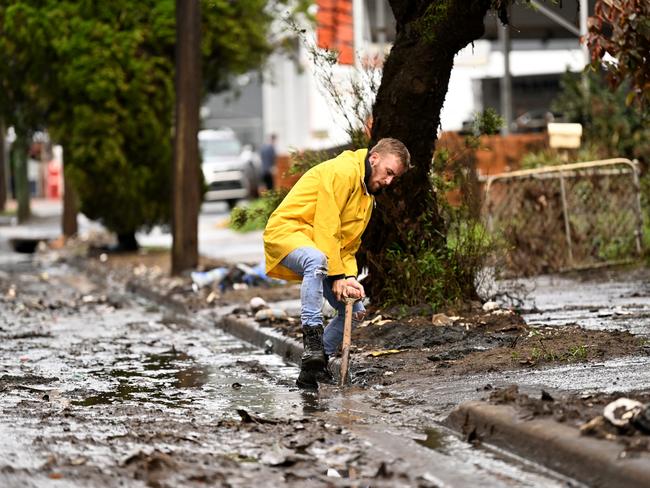 Lismore resident Eli Roth clears mud and debris on March 29, 2022. Picture: Dan Peled