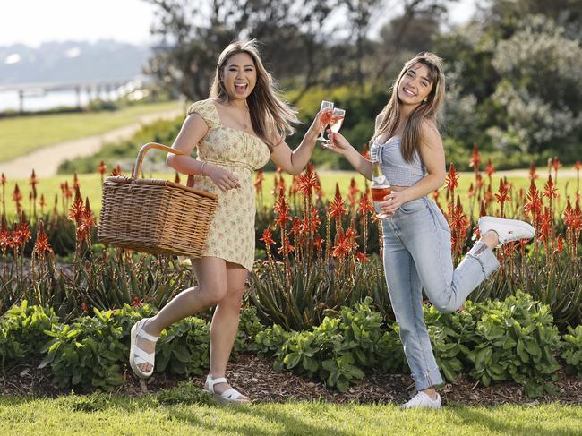 Cylina Tran, 21, and Isabella Jenkins, 20, are among the thousands of Victorians who will be able to enjoy an outdoor social gathering. Picture: Alex Coppel