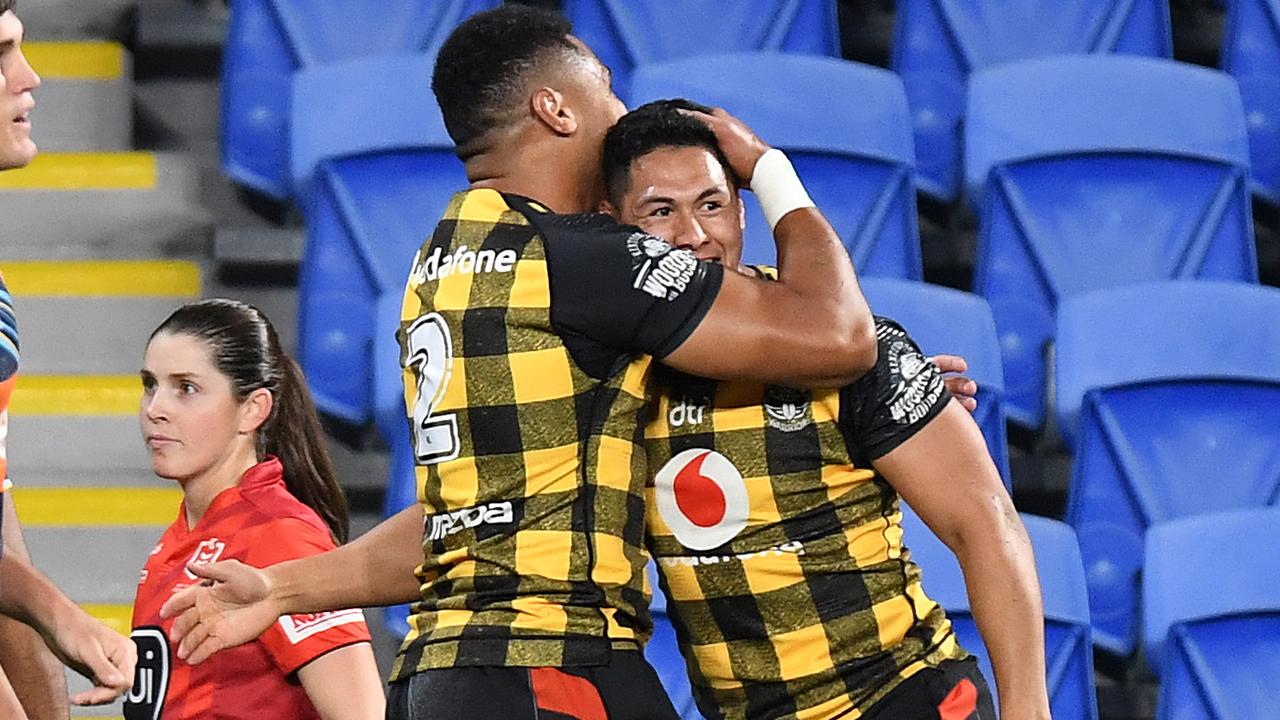 Roger Tuivasa-Sheck celebrates scoring his 50th NRL try.