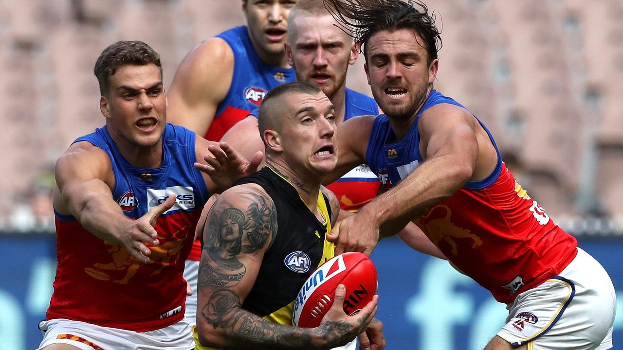 Dustin Martin of the Tigers is taken high around the kneck during the Round 4 AFL match between the Richmond Tigers and the Brisbane Lions at the MCG in Melbourne, Saturday, April 14, 2018. (AAP Image/Mark Dadswell) NO ARCHIVING, EDITORIAL USE ONLY