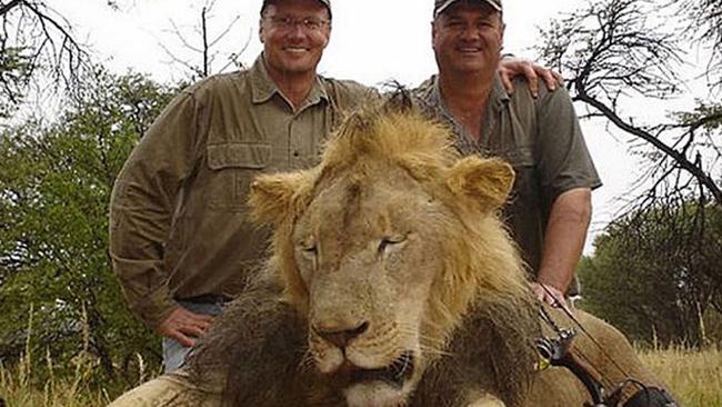 Walter J. Palmer (left) with one of his trophies. (man at right is unidentified) photo: facebook.