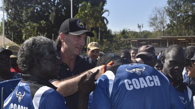 AFL incoming CEO Andrew Dillon presenting the medals to the Buffaloes following the win in the Tiwi Island Football League grand final between Tuyu Buffaloes and Pumarali Thunder. Picture: Max Hatzoglou