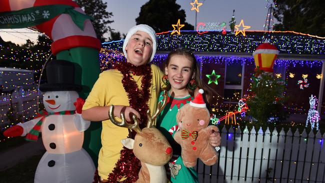 Cooper, 11, and Savannah, 9, outside their neighbour’s home in Seville. Picture: Josie Hayden