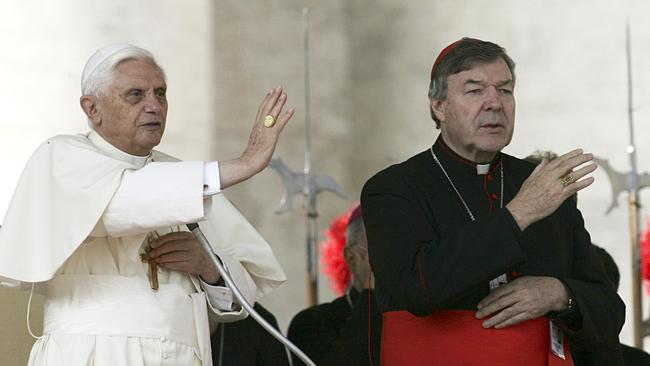 Pope Benedict XVI, left, and Cardinal George Pell bless the faithful during the weekly general audience in St. Peter's square at the Vatican in 2005.