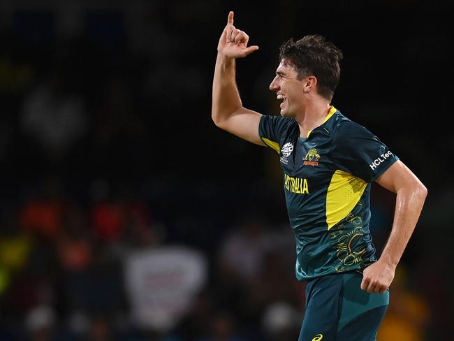 ST VINCENT, SAINT VINCENT AND THE GRENADINES - JUNE 22: Pat Cummins of Australia celebrates after dismissing Gulbadin Naib of Afghanistan (not pictured) for his hat trick during the ICC Men's T20 Cricket World Cup West Indies & USA 2024 Super Eight match between Afghanistan and Australia at Arnos Vale Ground on June 22, 2024 in St Vincent, Saint Vincent and The Grenadines. (Photo by Gareth Copley/Getty Images)