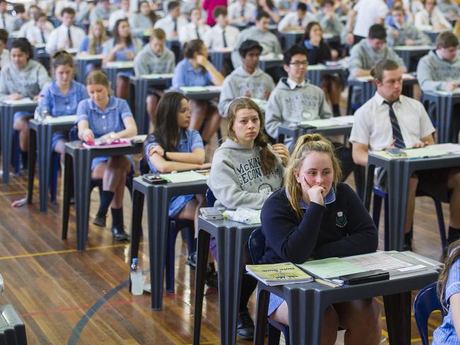 McKinnon Secondary College students file into the school's exam hall to sit a VCE paper.