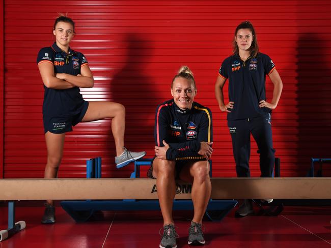 Crows star Erin Phillips pictured with fellow midfielders Ebony Marinoff, left, and Anne Hatchard, right. Picture: Tricia Watkinson