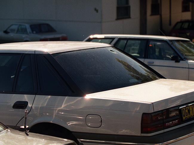 A bullet hole in the rear window of the car belonging to murdered Labor MP John Newman.