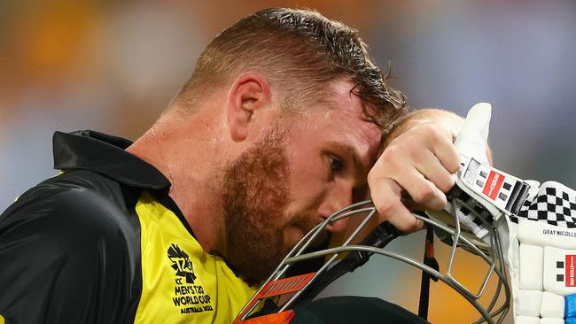 Finch walks back to the pavilion after his half-century. Picture: AFP